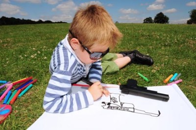 boy-drawing-picture-of-gun