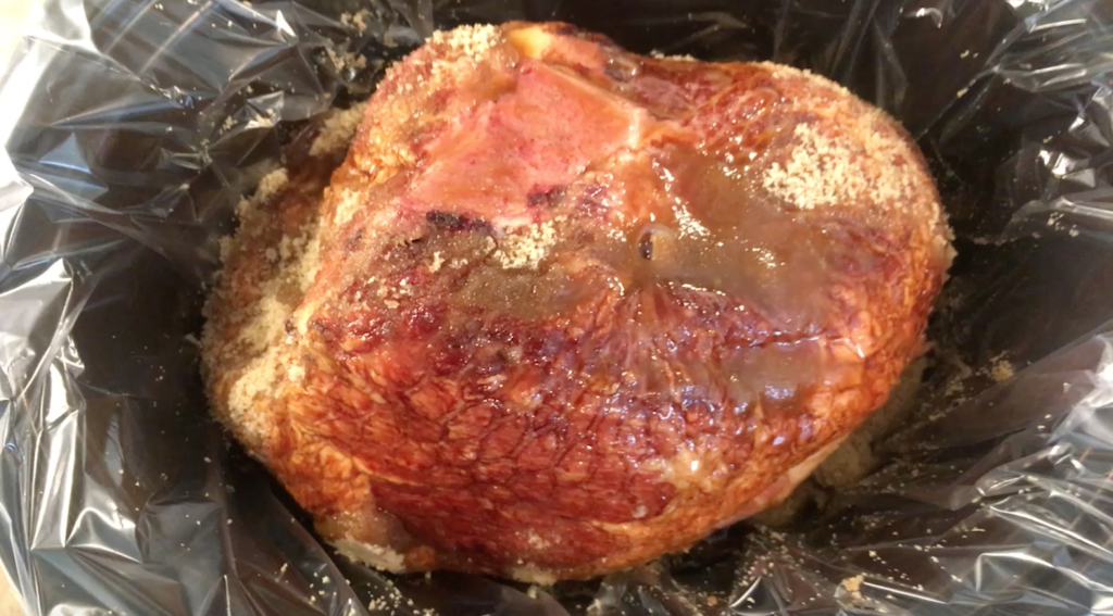 Rub sugar on all sides of the ham. Pour on maple syrup and add pineapple chunks and juice.